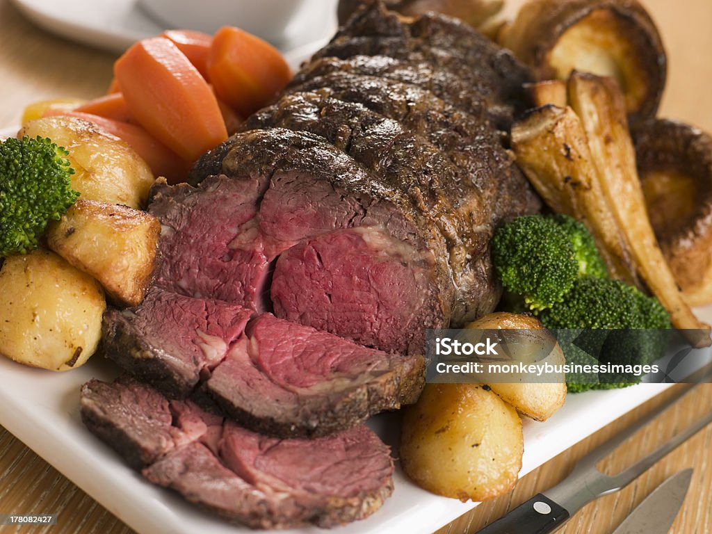 Roast Rib eye of British Beef with all the Trimmings Roast Rib eye of British Beef with all the Trimmings on White Dish Roast Beef Stock Photo