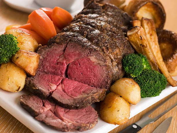 Roast Rib eye of British Beef with all the Trimmings Roast Rib eye of British Beef with all the Trimmings on White Dish roast beef photos stock pictures, royalty-free photos & images