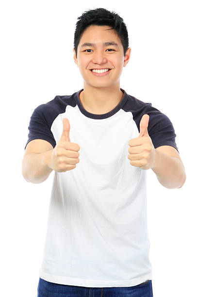 istock A young man giving a two thumbs up sign 178083316