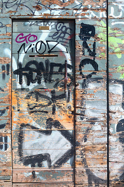 istock Graffiti on a grunge & old door 178083696