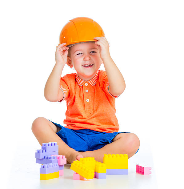 istock cheerful child boy playing with building blocks toy 178083738