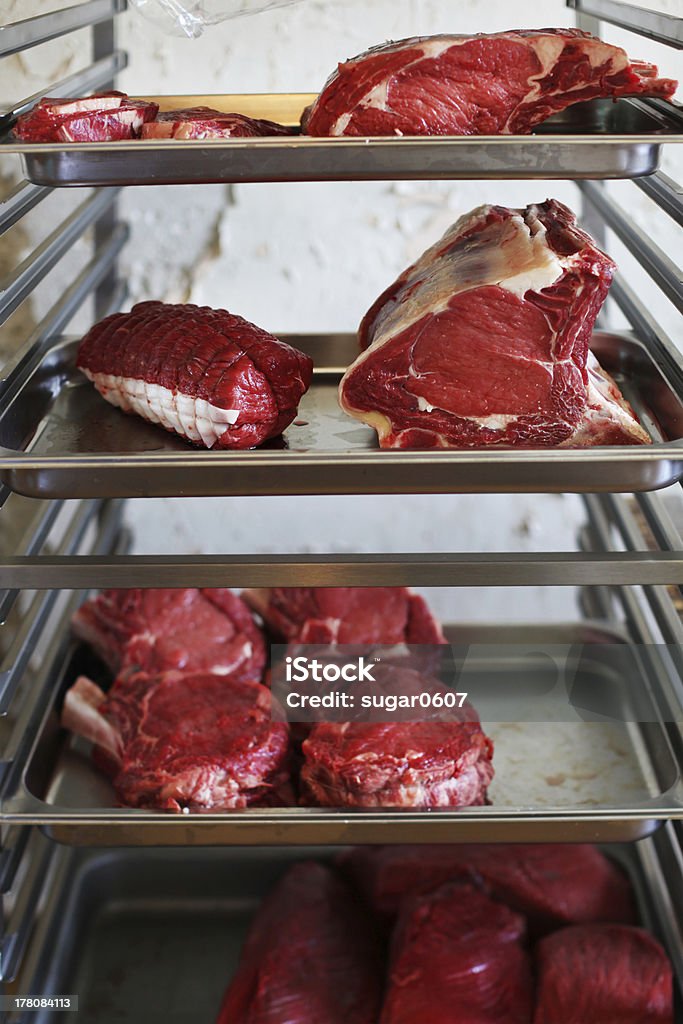 Raw meat, prime rib, steak, roast beef at butcher Raw meat cuts, prime rib, steak, roast beef at butcher shop on a rack American Culture Stock Photo