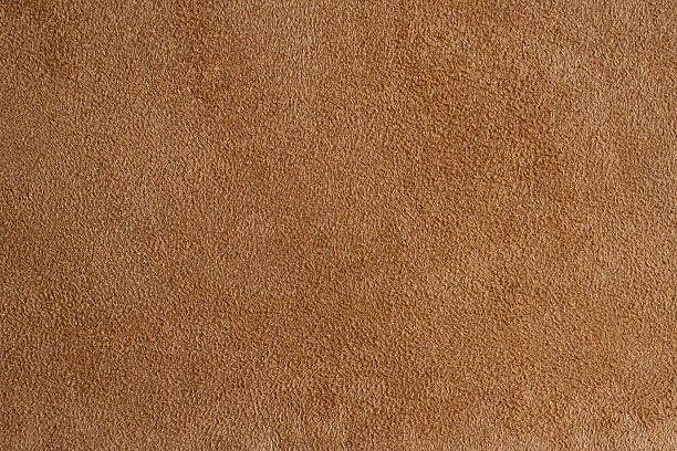 istock Closeup of brown suede fabric 178084232