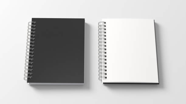 istock Notebook mockup. Closed and open blank notebook with black cover. Spiral notepad on white background 1780845896