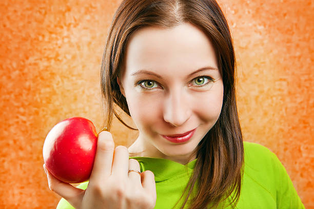 istock young woman with apple 178084939