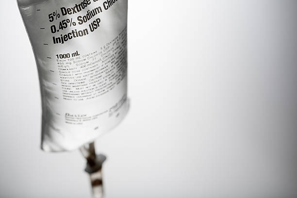 Saline bag on white background Saline bag on a white background.  saline drip stock pictures, royalty-free photos & images