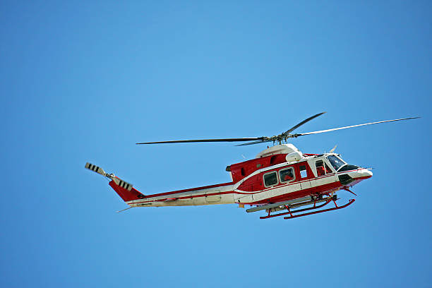 istock patrol helicopter of firefighters in blue sky over a fire 178086565