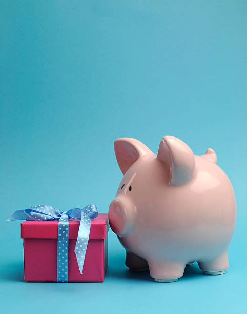 istock Pink Piggy Bank and gift - vertical with copy space. 178087141