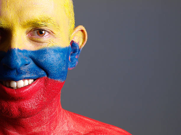 istock Man face painted with colombian flag, smiling expression 178087325