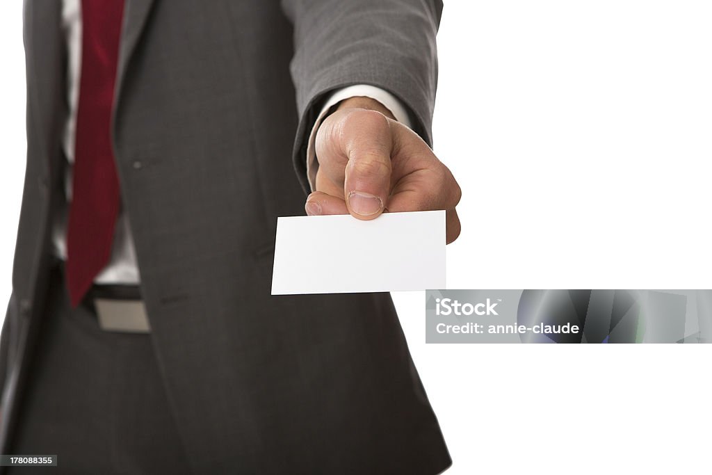 Business man showing blank card. "Business man showing blank card.Businessman handing a blank business card, isolated on white background.Businessman in gray suit and white shirt with red tie, shows white blank business card with space." Adult Stock Photo