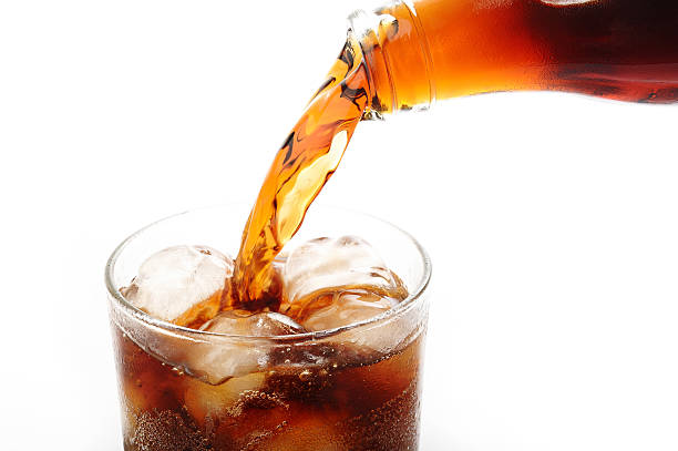 istock cola pouring into glass on white background 178088361