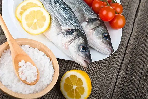 Photo of Steamed seabass with salt, lemon and tomato