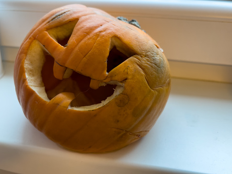 jack o'lantern rotten smelled pumpkin after halloween. pumpkin after celebration