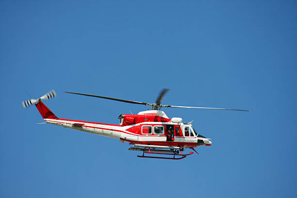 istock patrol helicopter of firefighters in blue sky over a fire 178088849