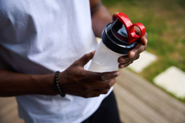 istock Guy in sportswear with a drinking bowl with water 1780889466