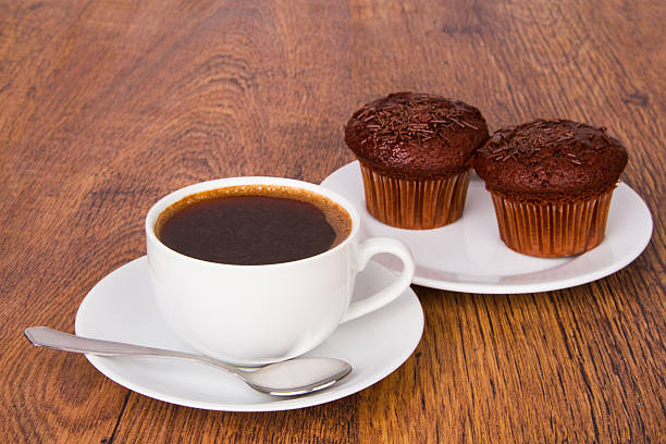 istock Cup of coffee with chocolate muffins 178089008