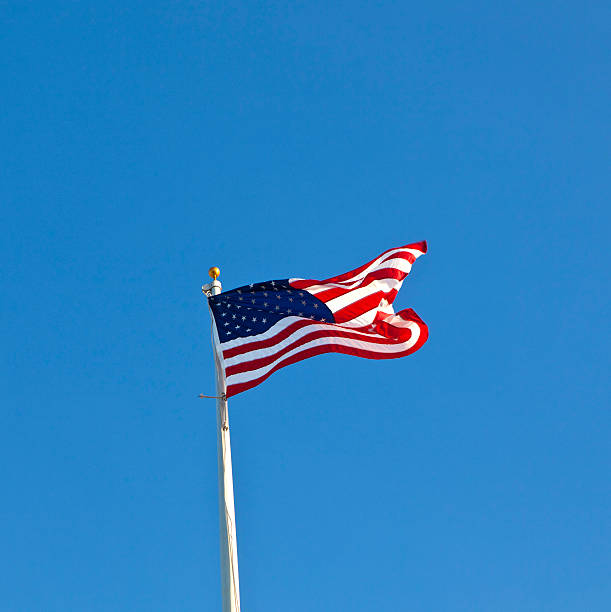 istock American flag waving against a brilliant blue sky 178089117