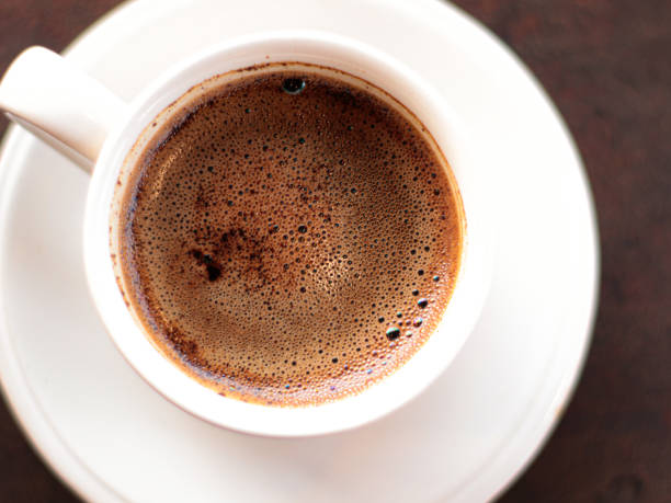 istock cup of hot coffee on wooden table 1780894352