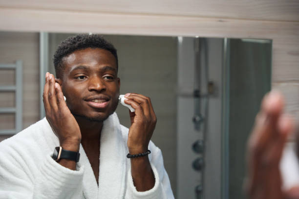 istock Young guy applies shaving foam to his face 1780895409