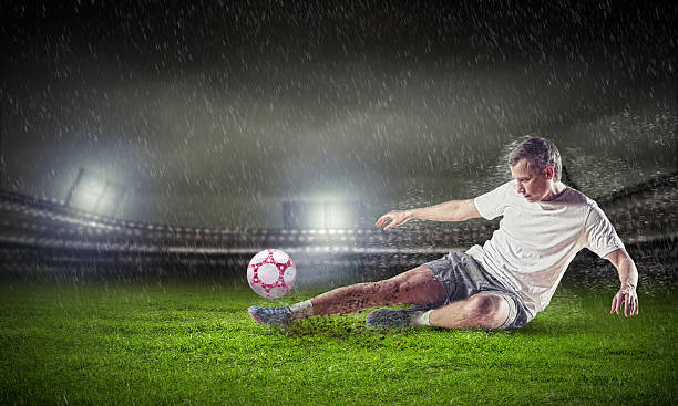 istock football player striking the ball 178089739