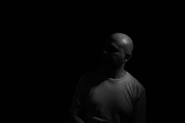 istock Low light portrait of bearded, bald man. 1780898731