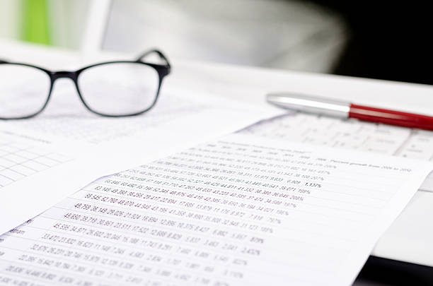 istock Business composition with laptop glasses pen and statistics sheets 178089962