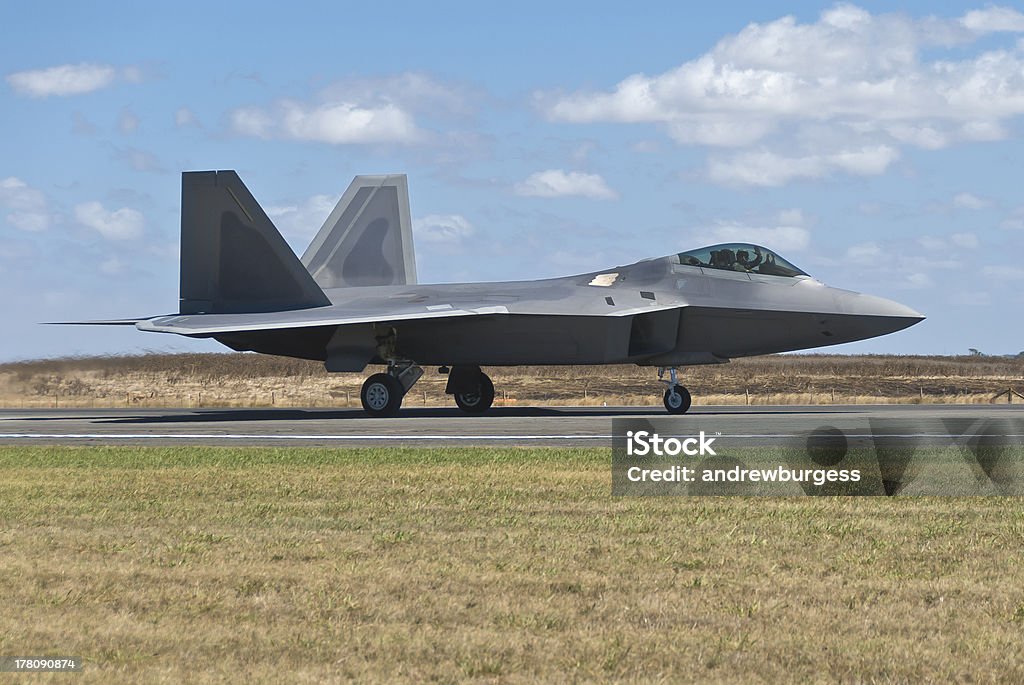 F-22 Raptor fighter bomber landing on runway. Advanced Tactical Fighter Stock Photo