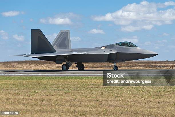 F22 Raptor Fighter Bomber Landing On Runway Stock Photo - Download Image Now - Advanced Tactical Fighter, Aerospace Industry, Air Force