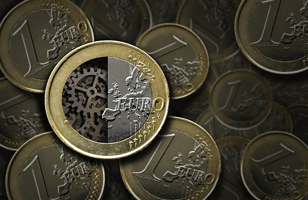 Euro coin with gears inside stock photo