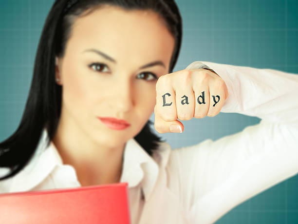 Woman in tough business world concept stock photo