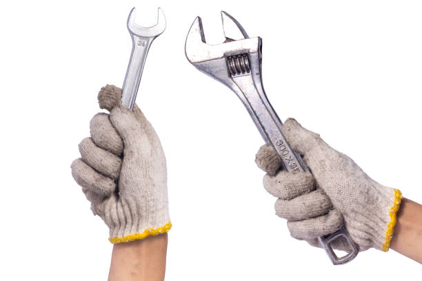 istock set handyman holding a wrench isolated on white background 1780928158