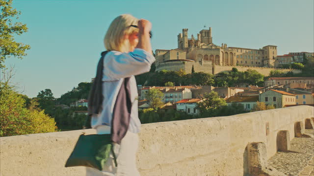 Vacation beside Cathedral Saint-Nazaire and Pont Vieux at Beziers, France.