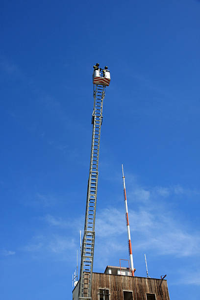 istock firefighters in basket of the scale 178093509