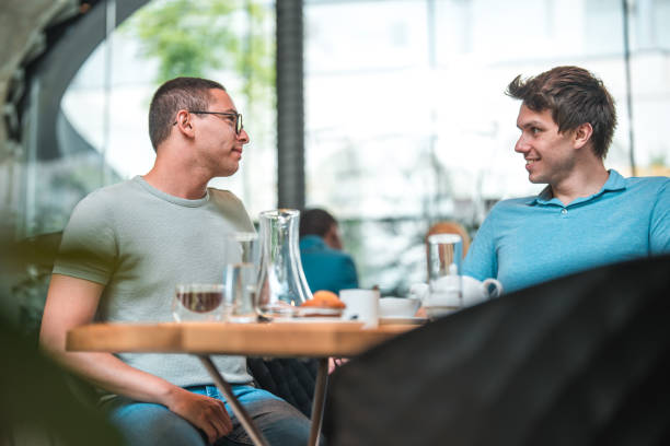 istock Hispanic and Caucasian Friends Enjoying Artisan Coffee 1780935335