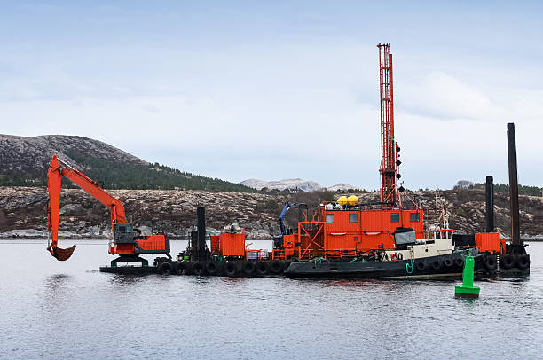 istock Red dredger (digging support vessel) works in Norwegian sea 178093568