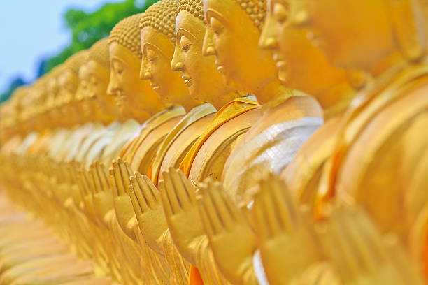 istock Row of golden buddha statue 178093971