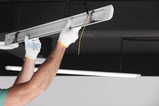 istock Ceiling light. Electrician installing led linear lamp indoors, closeup. Space for text 1780939818