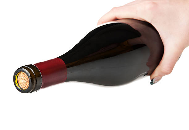 istock bottle of wine in hand 178094595