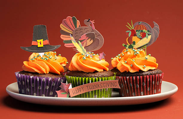 istock Happy Thanksgiving cupcakes with turkey, feast, and pilgrim hat decorations. 178095187