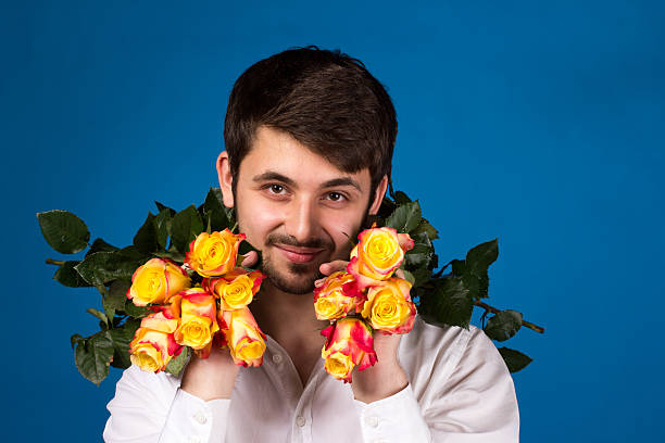 istock Man with bouquet of red roses 178095410