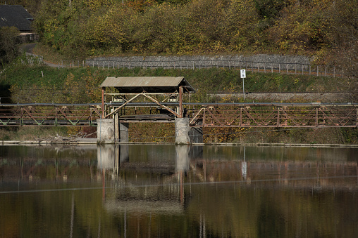 energy production with run of the river hydroelectric power station, splashing water