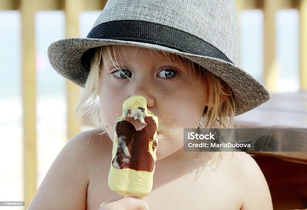 cute girl in the hat cute girl in the hat eating ice-cream Baby - Human Age Stock Photo