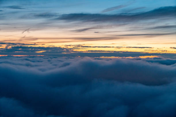 istock Flying above the clouds at dusk 1780982650