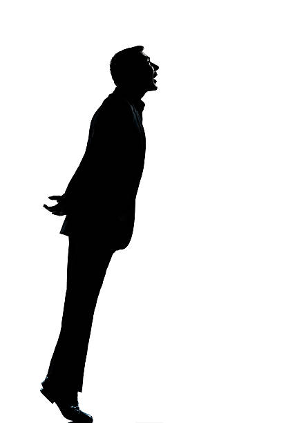 istock one business man silhouette tiptoe looking up 178100206