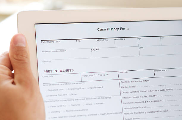 case history form on digital tablet Doctor holding a digital tablet with a case history form. anamnesis stock pictures, royalty-free photos & images