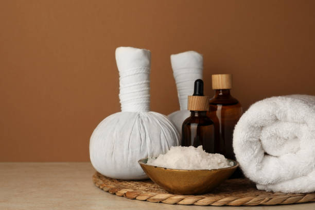 istock Composition with different spa products on beige table against brown background. Space for text 1781003411