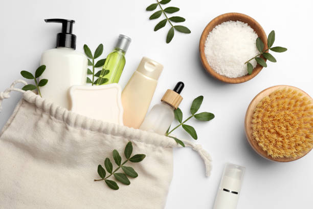 istock Preparation for spa. Compact toiletry bag, twigs and cosmetic products on white background, flat lay 1781004034