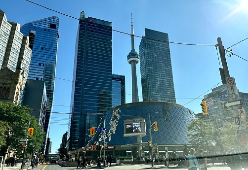 toronto, canada - september 15 2023: downtown view of the busy and crowded city center of the vibrant city with the famous cn tower and people on the street