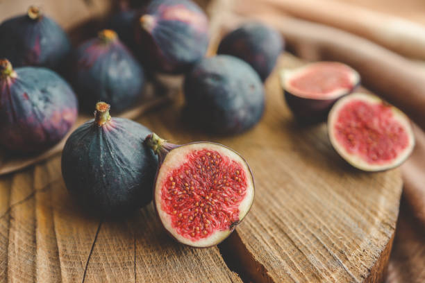 istock A few figs in a bowl on an old wooden background. 1781008954