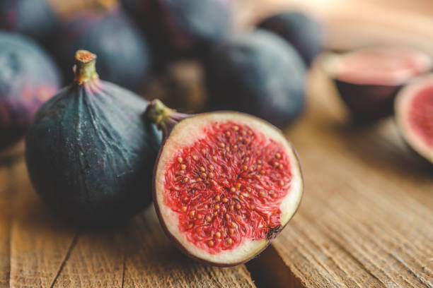 istock A few figs in a bowl on an old wooden background. 1781009355